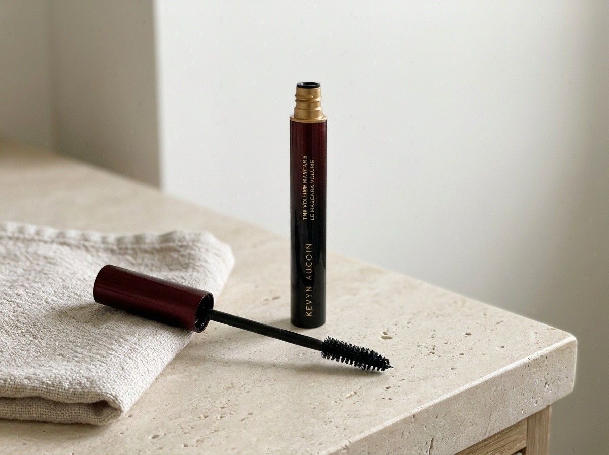 Kevyn Aucoin The Volume Mascara on a warm stone vanity