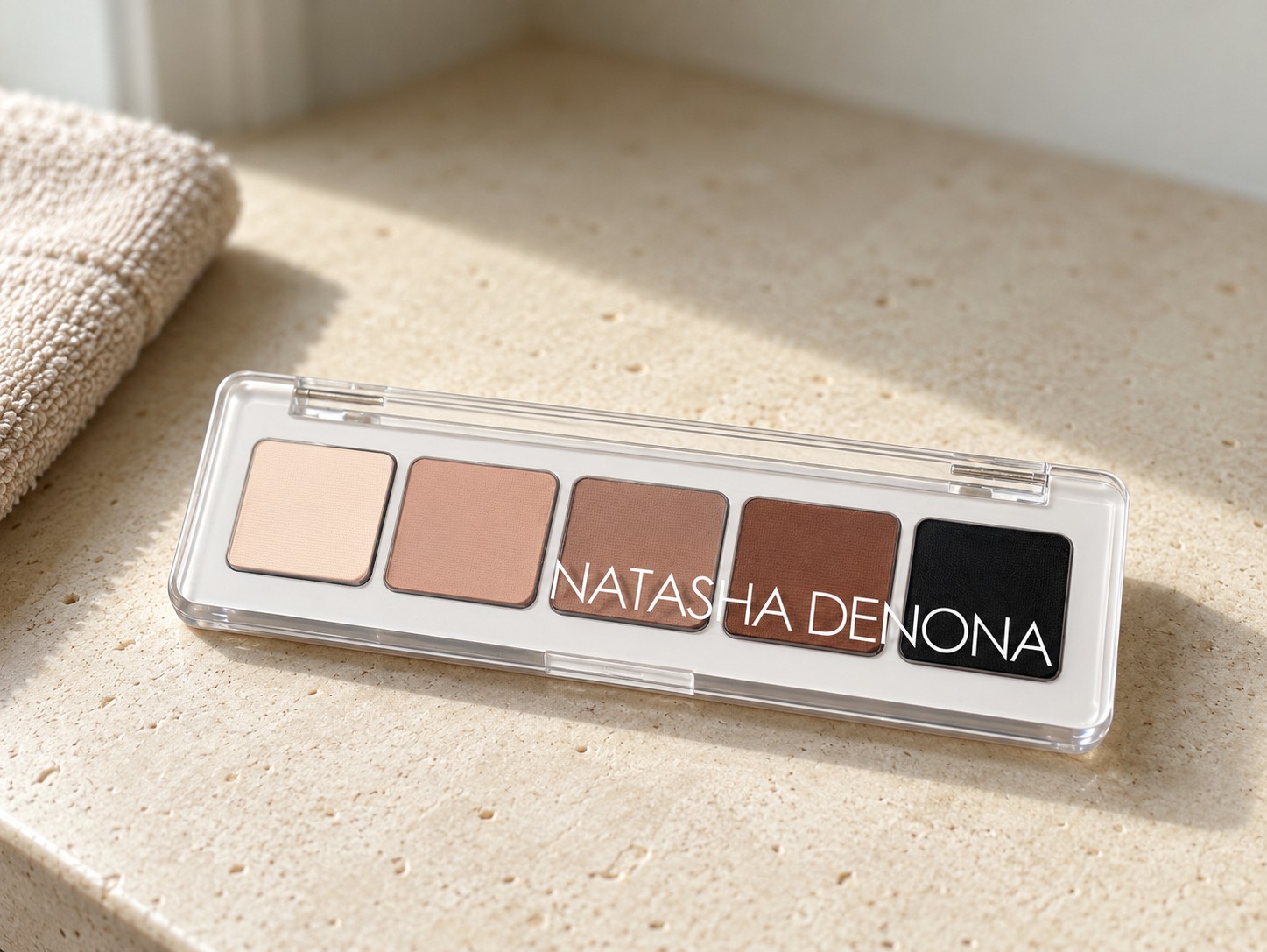 Natasha Denona Mini Eye Sculpt Palette in Original on a warm stone vanity