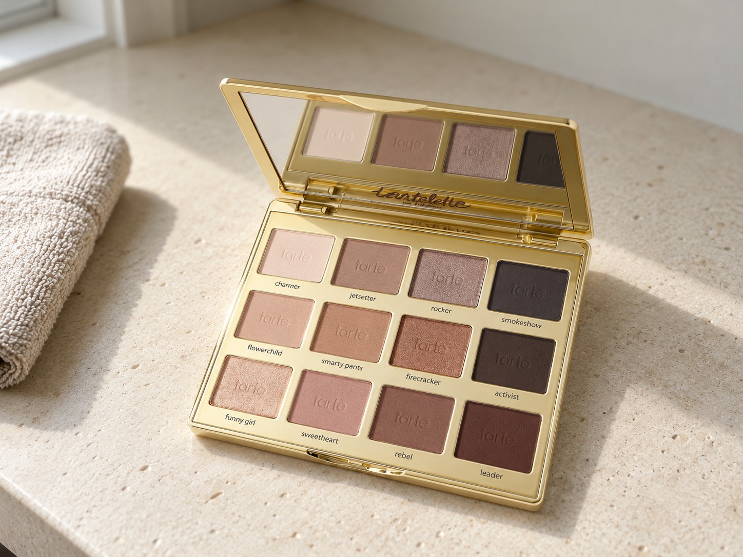 Tarte Tartelette In Bloom Amazonian Clay Palette on a warm stone vanity